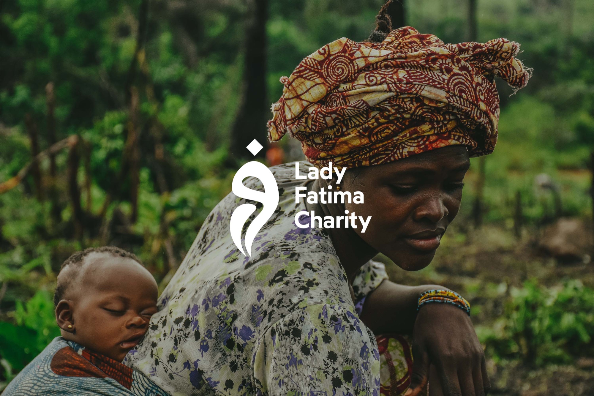Lady Fatima Charity — the logo reversed in white over a photograph of a mother carrying her baby