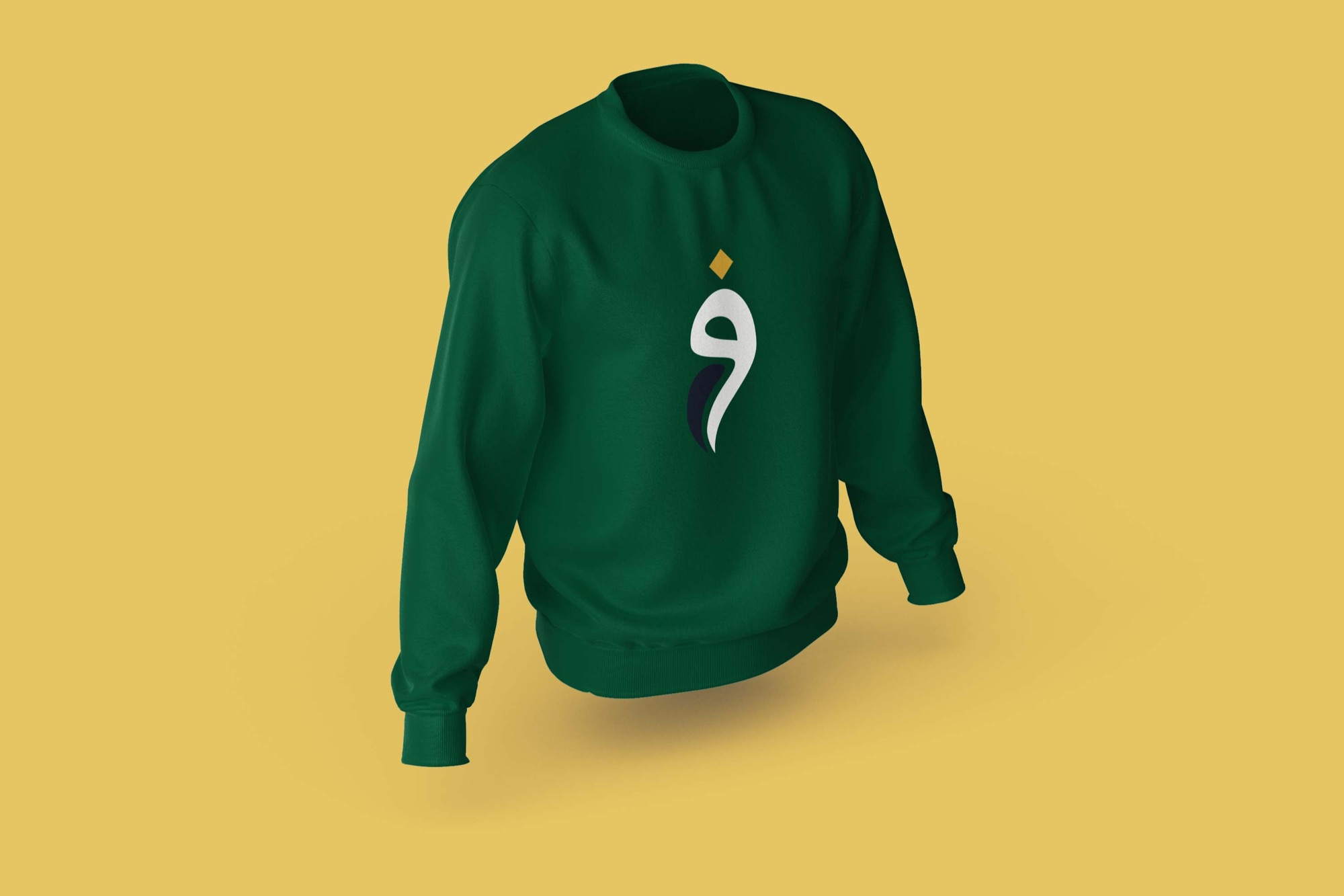 Lady Fatima Charity — the monogram on a green sweatshirt