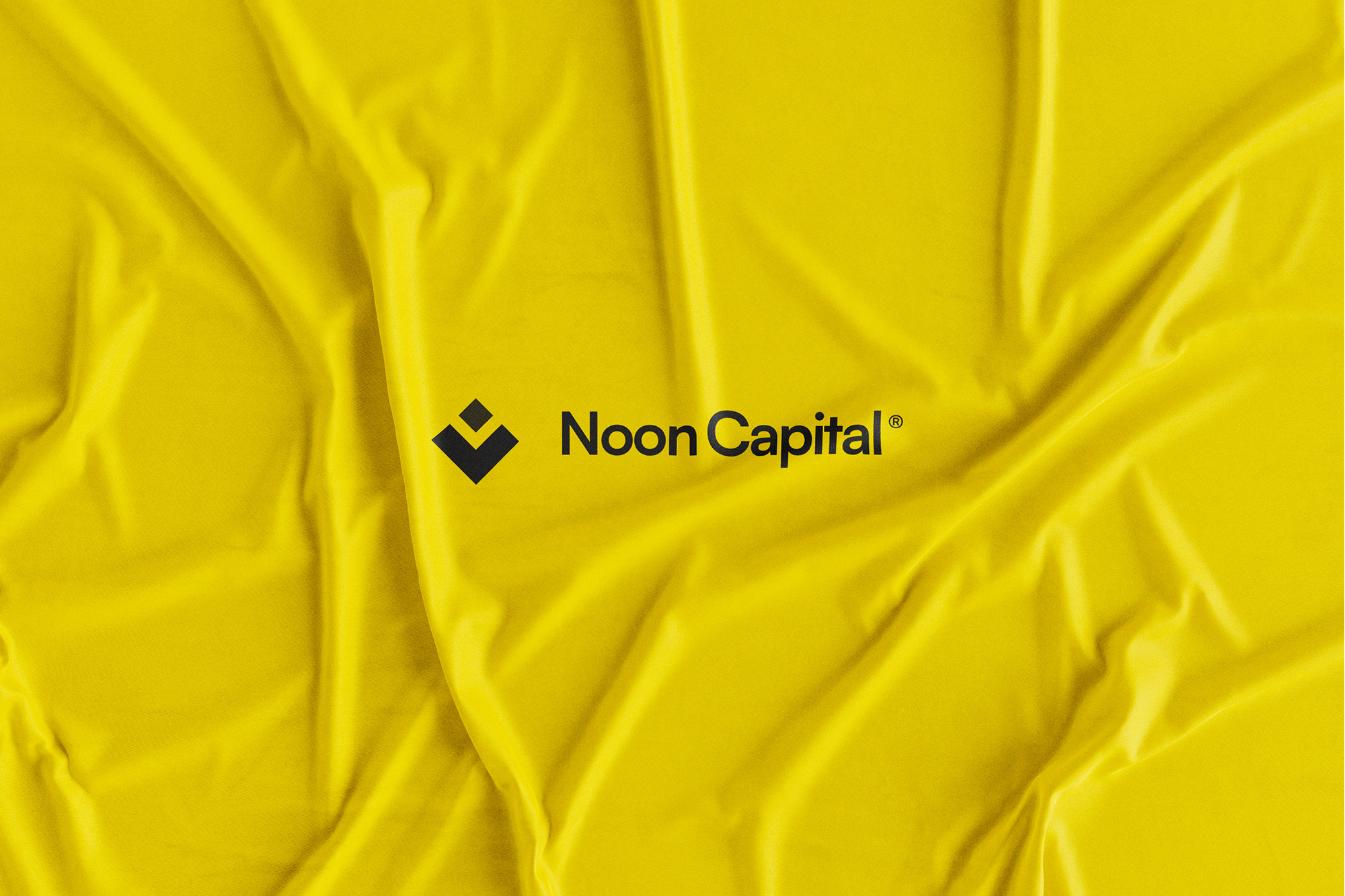 Noon Capital — the logo on yellow fabric